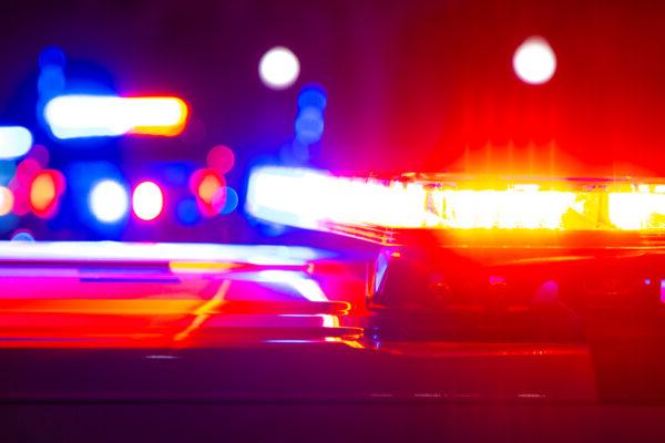 Red and blue flashing police lights at a crime scene.